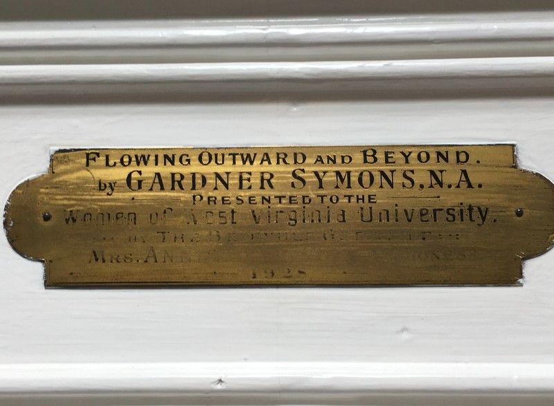 Dedication plaque for George Gardner Symon's "Flowing Outward and Beyond," on display in the lobby of Elizabeth Moore Hall