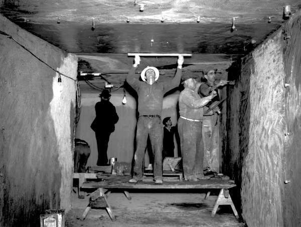 Tunnel, beneath Lasalle Street: WPA workers completing the tunnel connecting Hutchinson Memorial to Charity Hospital. The passage way is approximately 150 ft. long and 10 ft., and it was used to connect the LSU medical school and the hospital. Courtesy of