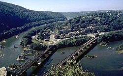 Aerial view of the bridges. The Piers of the Bollman Bridge are still visible on the left.