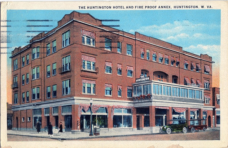 The Hotel Huntington, featuring a glass-enclosed balcony over its entrance