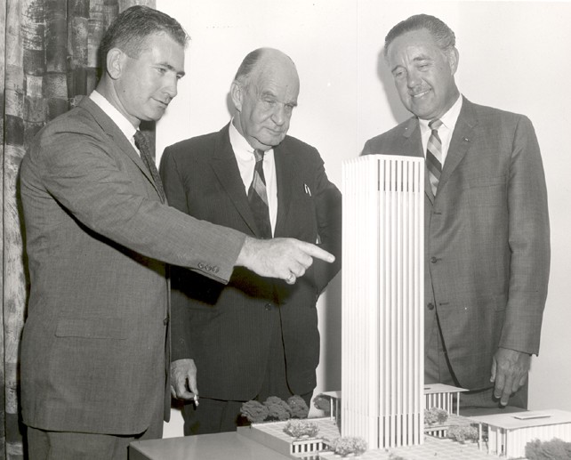 Model of Electronics Research Centers first phase of construction is examined by Dr. Albert J. Kelley, Deputy Director; Edward Durell Stone (center), architect, and Dr. Winston E. Kock, Director. Courtesy of NASA