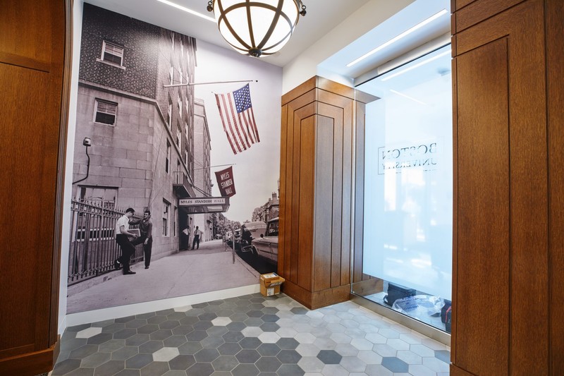 The Inside of the lobby featuring an older photo of Myles Standish Hall