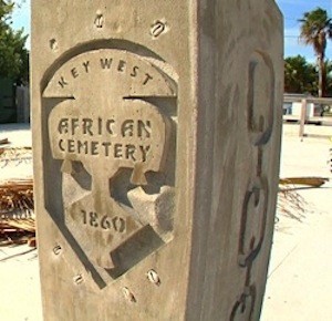 One of the pedestals, decorated by African Adinkra symbols and finished with engraved bronze plaques