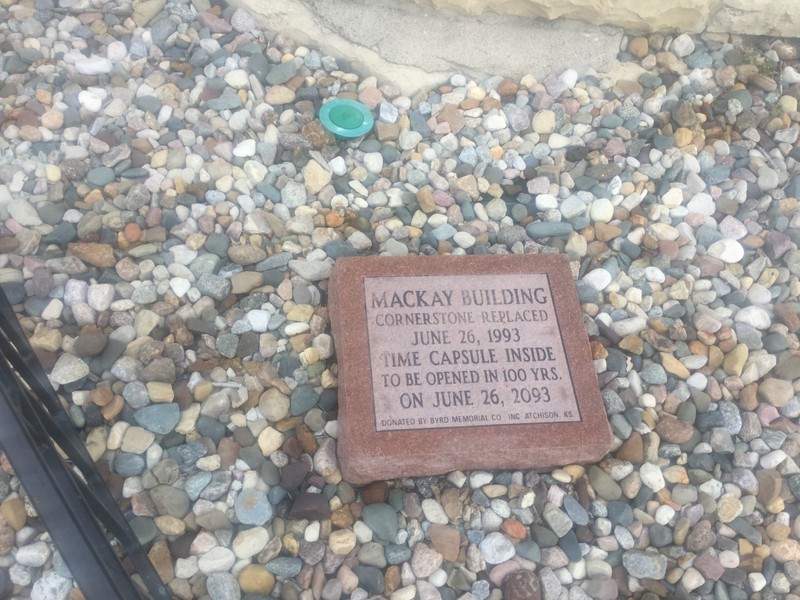 A paving stone detailing the time capsule inside the cornerstone, that is to be opened in 2093.