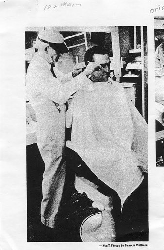 Alonzo Randolph trimming one of his (last) customer's hair before his retirement.