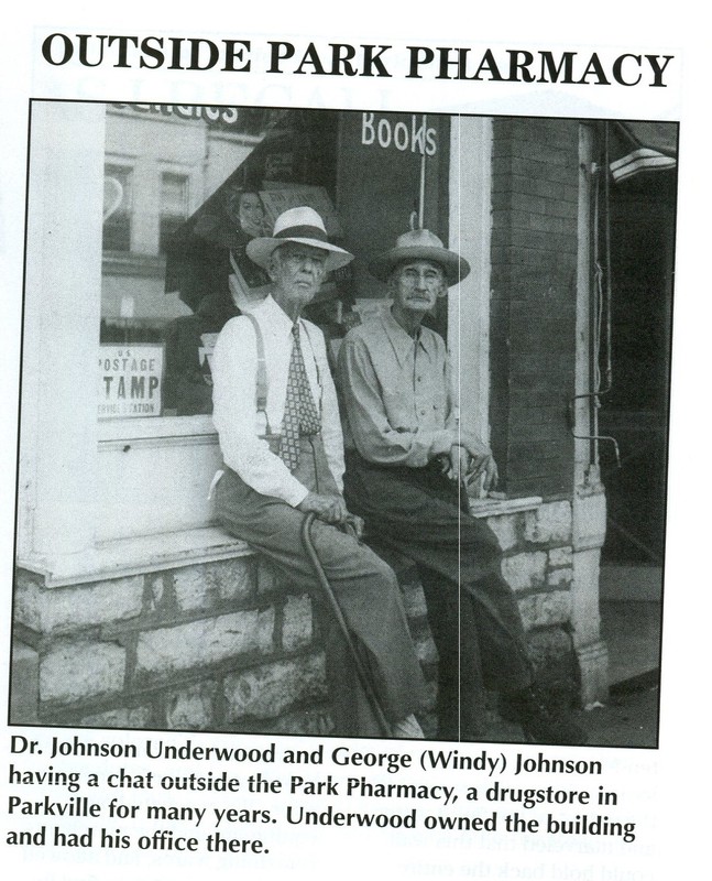 Dr. Johnson Underwood and George (Windy) Johnson having a chat outside the Park Pharmacy, a drugstore in Parkville. Underwood owned the building and had his office here.