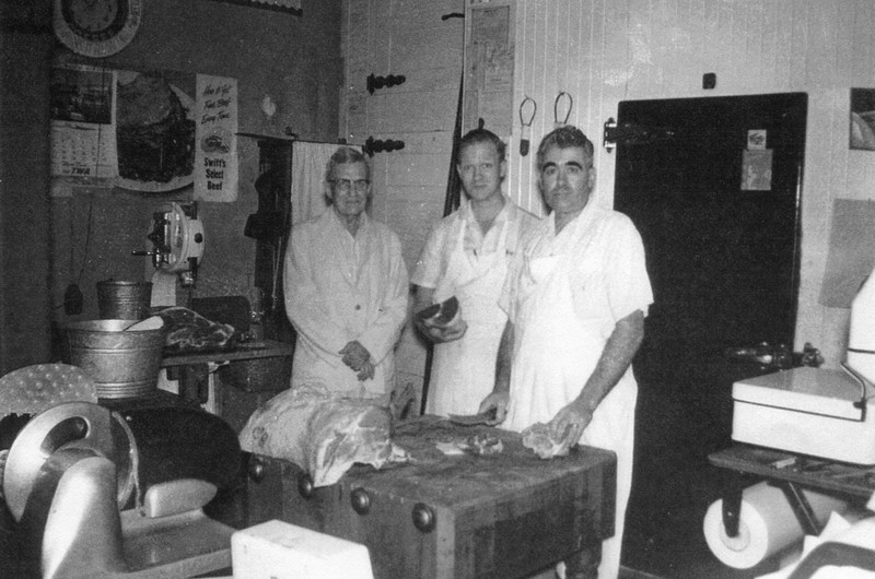 A view of the butcher's area inside Vawter's Super Market during the late 1950s. Pictured are Mr. Vawter, Bill Vawter, and Wilbur Williams.