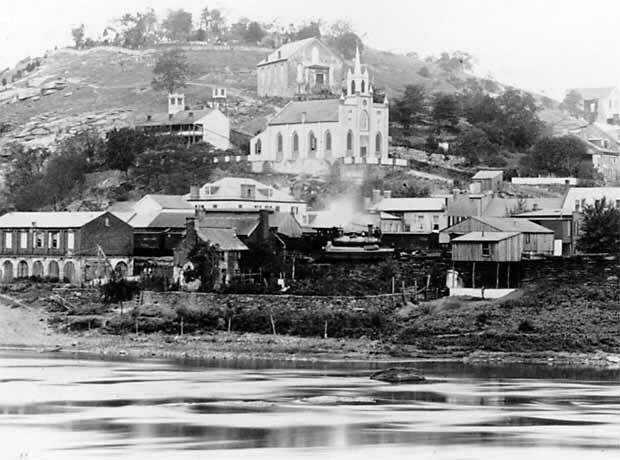 The original church, seen in the center, around 1890. Courtesy of http://www.histarch.illinois.edu/harper/1890church.jpg