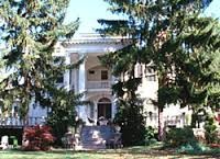 Modern photo of the striking, tree covered entrance to the present Albermarle Inn. Photo from the City Department, City of Asheville, North Carolina.