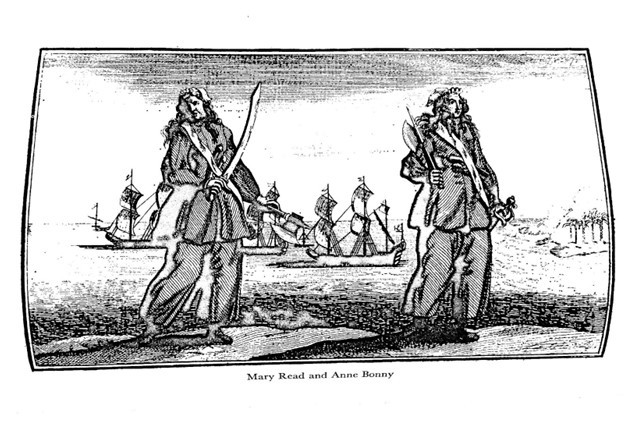 An illustration of Anne Bony and Mary Read standing on a cliff face with weapons drawn and ships behind them.