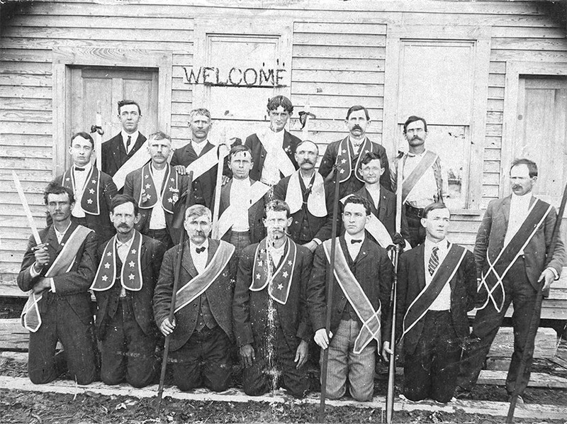 A black and white photo of a group of men from a sorority. 