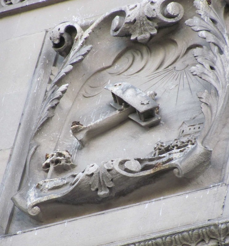 A close-up of one of Alexander Sangernebo's bas-relief sculptures, in this case a biplane.