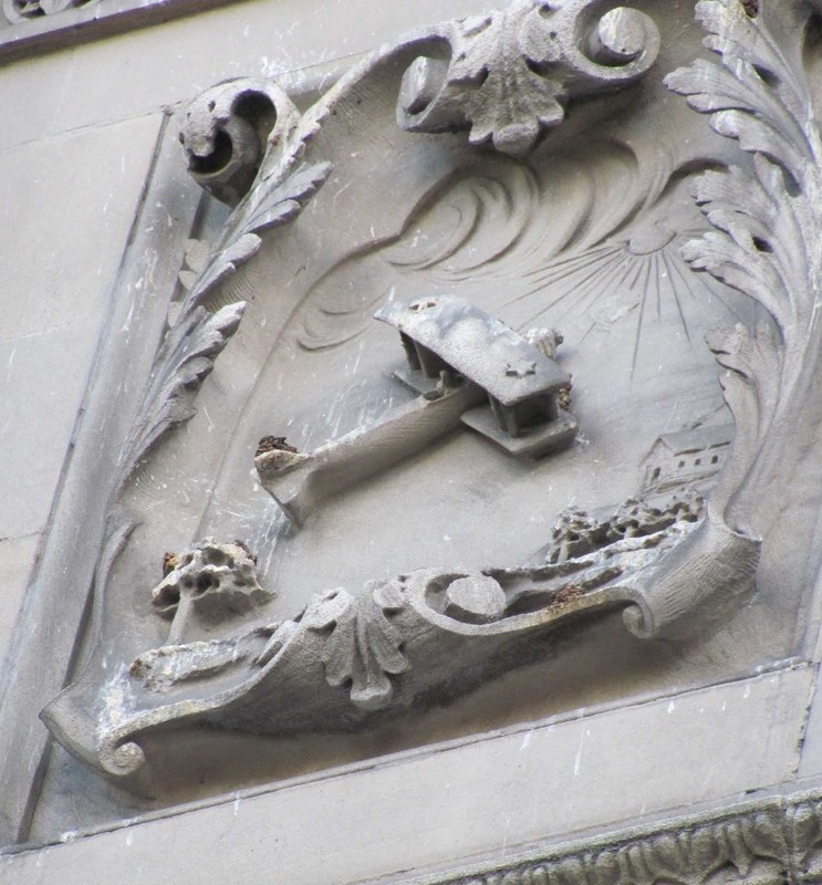 A close-up of one of Alexander Sangernebo's bas-relief sculptures, in this case a biplane.  