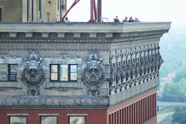 A close-up of the building's crown which features ornate terra cotta moldings.  