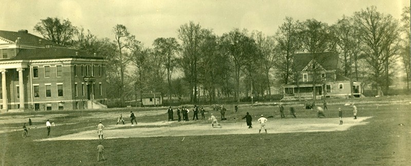 The Greyhounds baseball team practices in a field adjacent to Good Hall (on the left) in this early 20th century photograph.