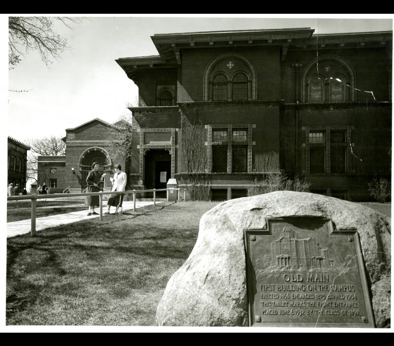 Shevlin Hall in 1954, with a plaque commemorating Old Main  