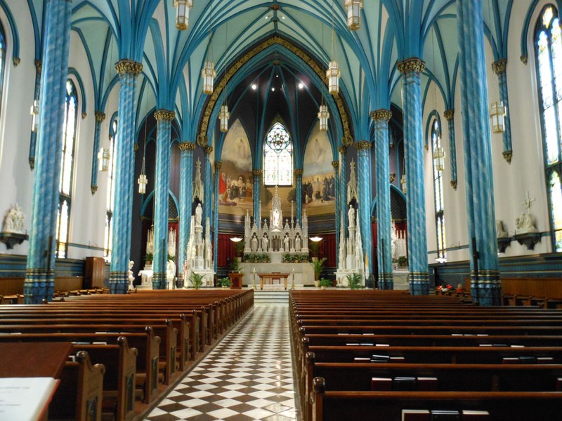 Interior view of the church showing the blue colors on the columns. Photo: Christine M. Grote. https://randomthoughtsfrommidlife.files.wordpress.com/2012/07/14-st_xavier-2012-07-11.jpg