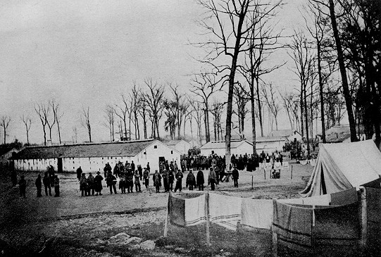 View inside prison at Camp Morton near Indianapolis, Indiana, the summer and autumn of 1864. Note substantial and comfortable barracks Source: Prisoners of War, 1861-65