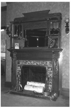 Inside the house, view of the fireplace, photographed by David Ransom