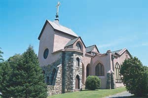 The exterior walls feature rubble stone (lower half) and stucco (upper half). (source: Archdiocese of Hartford)