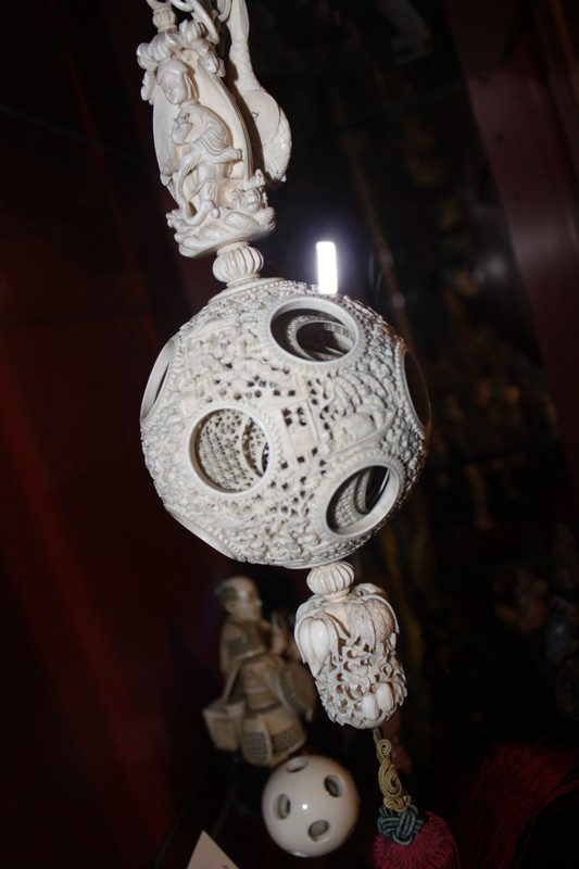 An intricately carved set of sixteen, lace-like balls, were carved in place, one within the other from a single piece of ivory. The set was likely used as part of a Hindu religious ceremony. Each of the sixteen balls fully rotates within its larger counterpart and is said to have required three generations in India to complete.