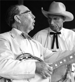 Bascom Lamar Lunsford playing the banjo, circa 1940. Photo by Hugh Morton, archived at the North Carolina Collection, University of North Carolina at Chapel Hill.