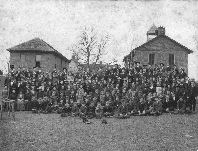 The students and faculty of Mars Hill College assembled on the upper quad in 1902. Founders Hall can be seen in the back left of this photo.