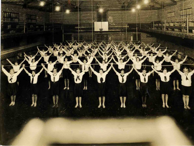 Female students exercising in McConnell Gym, 1924