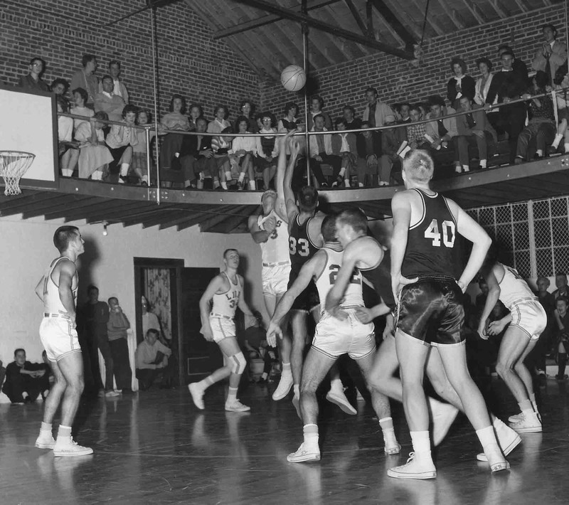 Men's basketball game taking place in McConnell Gymnasium