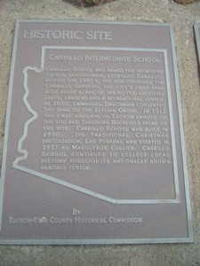 This historical marker is located on stone monument in front of the entrance.