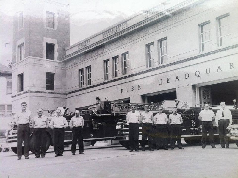 Fire Headquarters with firefighters and trucks