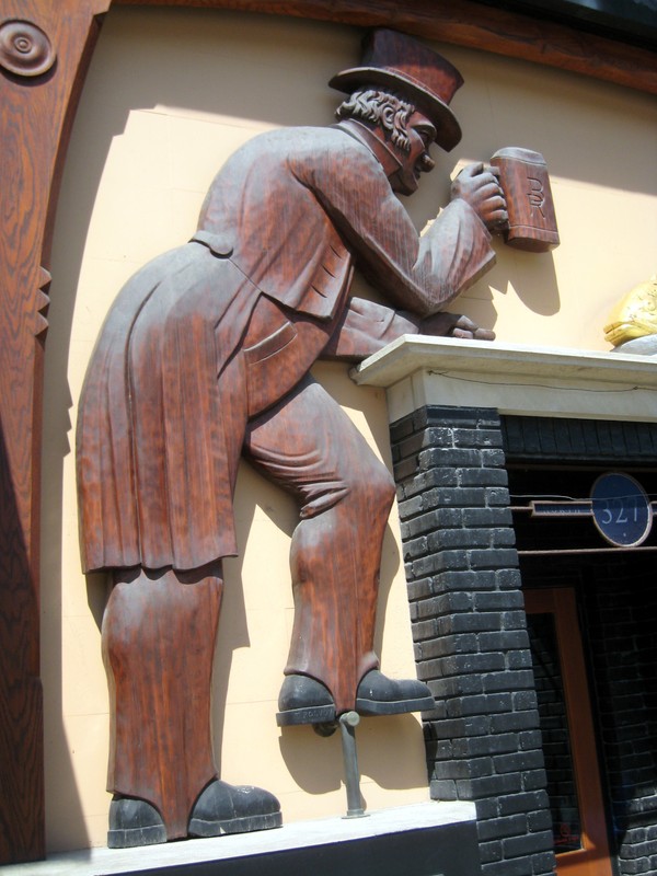 Joachim Jungwirth & Co. Brass Rail Woodcarving, left figure detail, 2020