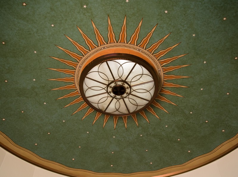 A close up of the interesting light fixture within the lobby.