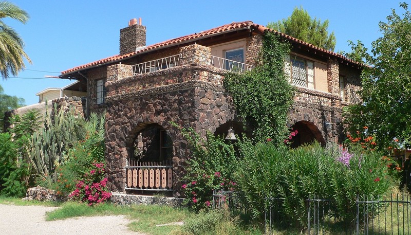 The Copper Bell Bed and Breakfast building was constructed around 1910 and is one of the few examples of volcanic stone construction in Tucson.