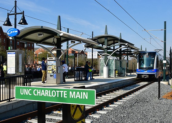 UNC Charlotte Main Station platform with LYNX Blue Line train pulling in. The station is the northern terminus of the Charlotte Lynx Blue Line.
