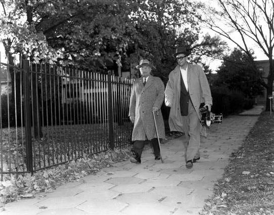 The President taking an evening stroll around the neighborhood with a photographer.