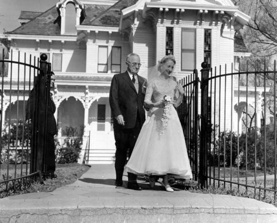 The President escorting his daughter from their house to her wedding in 1956, three years removed from his presidency.