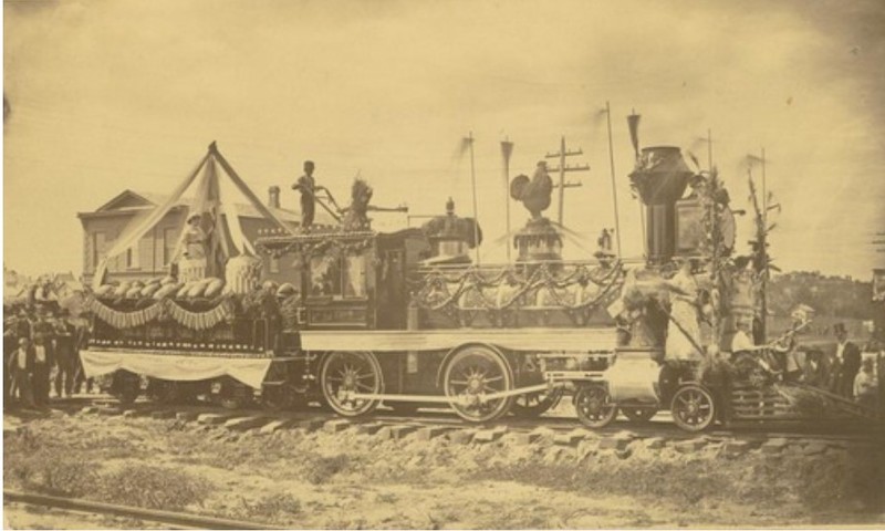 AT&SF Steam locomotive #100, Little Buttercup, in Sept. 1880 photo in Atchison by J.R. Riddle (KSHS)