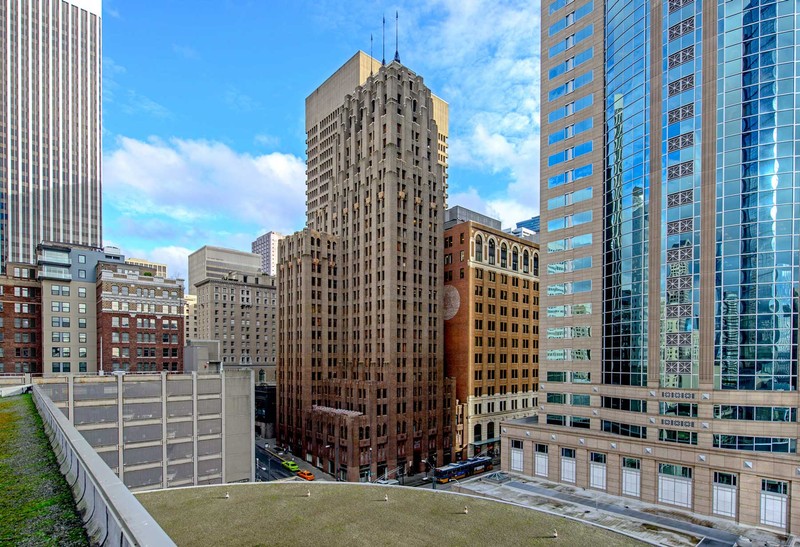 Photo by Mark Ambler (See: https://pauldorpat.com/2013/02/16/seattle-now-then-the-northern-life-aka-seattle-tower/)