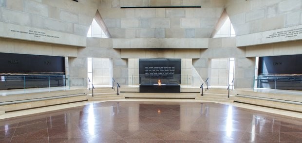 Hall of remembrance at the USHMM. Here, visitors are able to light memorial candles to remember the lost lives. The eternal flame is also shown here in the center of the room surrounding the names of concentration and death camps. 