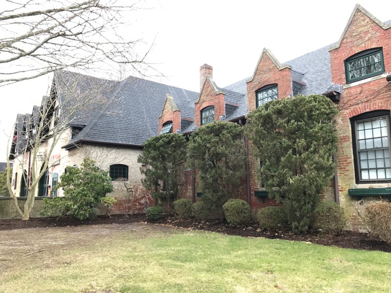 Wallace Hall. Steep ceilings and long windows are common features of the Tudor Revival Style. 