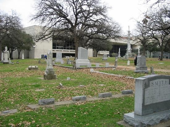 The Pioneer Park Cemetery with the Confederate Memorial and part of the Kay Bailey Hutchinson Convention Center complex in the background.