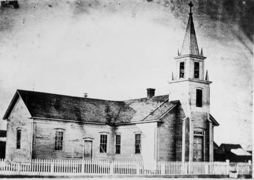 Historic photo of Christ Chapel at its firs location (with its additional wing) on 7th St. & Bannock. Provided by Boise State University Library, Special Collections and Archives.