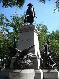 The statue depicts Kosciuszko holding a map of the fortifications at Saratoga in his right hand and a sword in his left. 