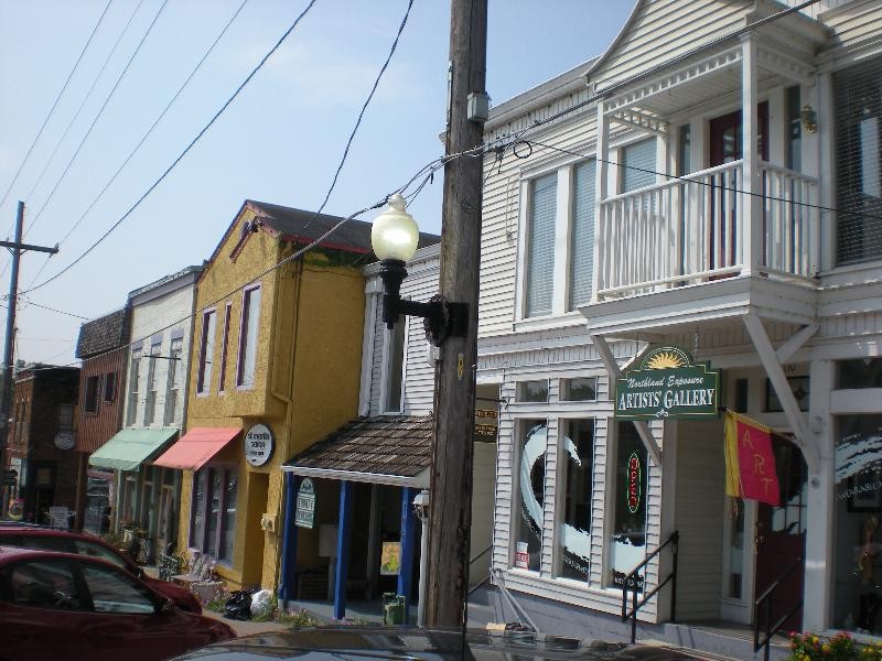 104 Main Street (yellow structure when the building was known as St. Martin Salon; unknown date.