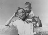 Dorothea Lange photograph of grandfather and grandson at Manzanar Relocation Center.