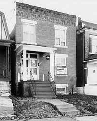 The house is a private residence located on a quiet street lined with similar structures in the predominantly Black Fairgrounds Neighborhood of St. Louis