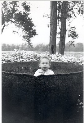 A Bixby grandchild poses in the trypot (1930s)