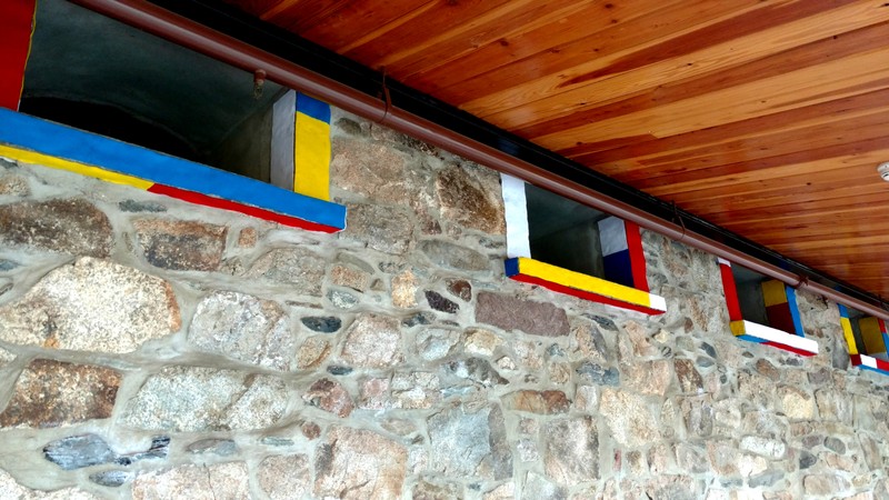 Windows built into the stonework of the hallway: possibly served as original windows on the exterior of the stables at one point. Photo taken by Ellen Tuttle.