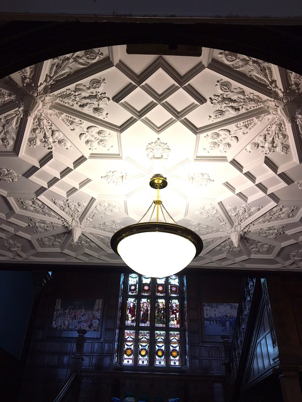 Gothic Revival Style ceiling by Dudley Newton with stained glass windows by Charles Kempe in the background 